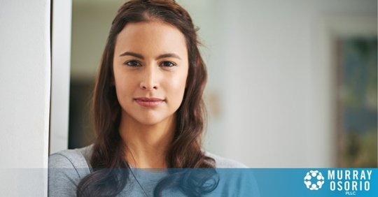 Woman foreign national looking at camera
